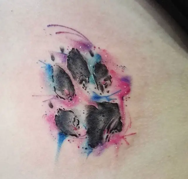 paw print in watercolor tattoo