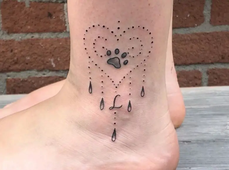 14 Beautiful Paw Print Tattoos That Might Just Convince You to Get Inked   The Dog People by Rovercom