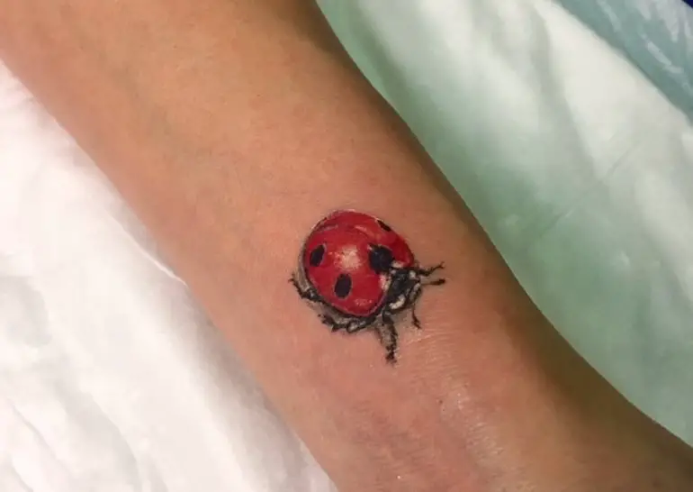 Realistic Ladybug Tattoo on the wrist